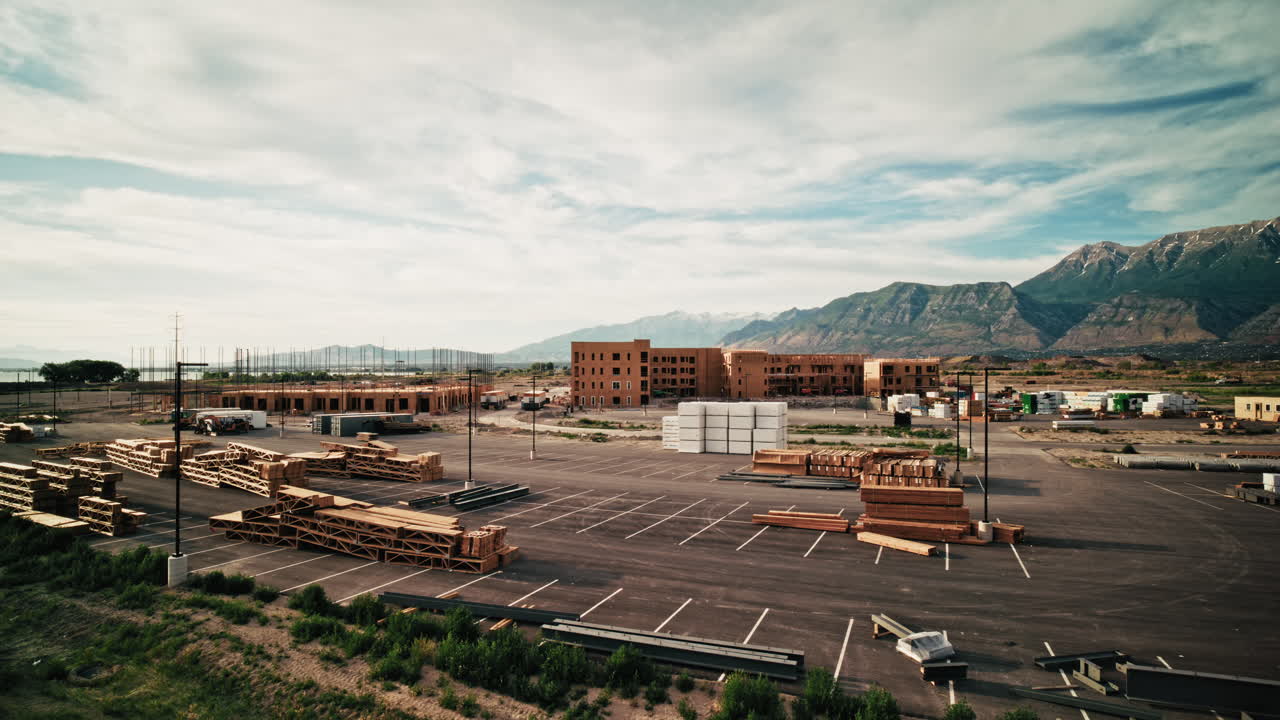 Construction Site of Apartment Complex with Mountains in Background