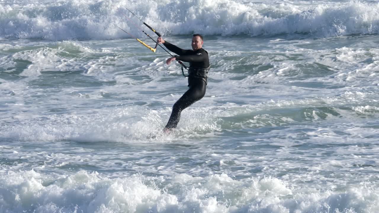 Kitesurfer Riding Waves in the Ocean