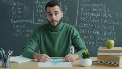 teacher explaining a flowchart