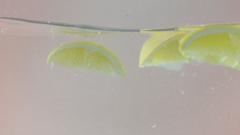 lemon slices splashing in water