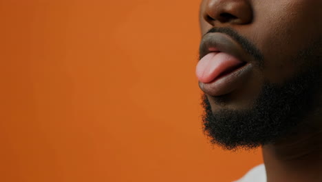 close-up of a man sticking out his tongue