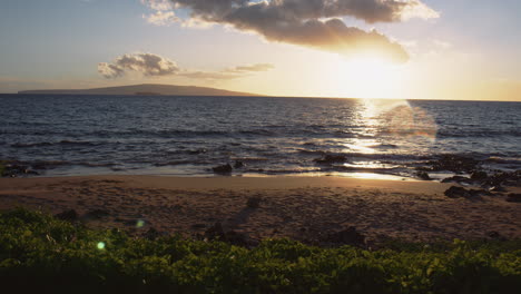 sunlight reflection on the tropical beach resort during sunrise in wailea, maui, hawaii, united states, static shot