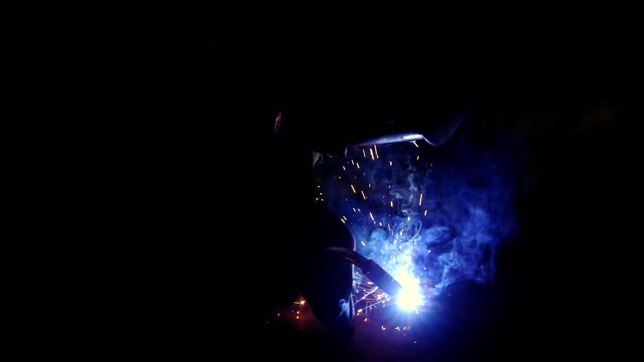 Welder working on a piece of metal