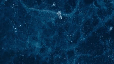 overhead view of frozen omundvatnet lake during winter in indre fosen, trondelag, norway