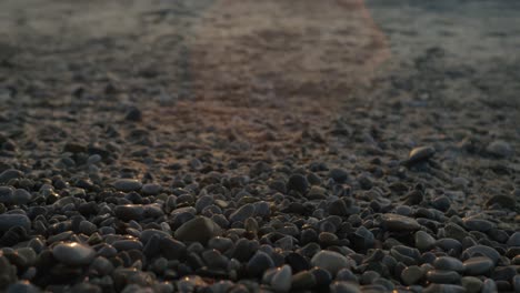 close up of tide coming in on rocky beach