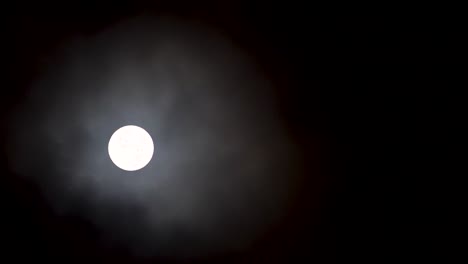 clouds drifting across the moonlight