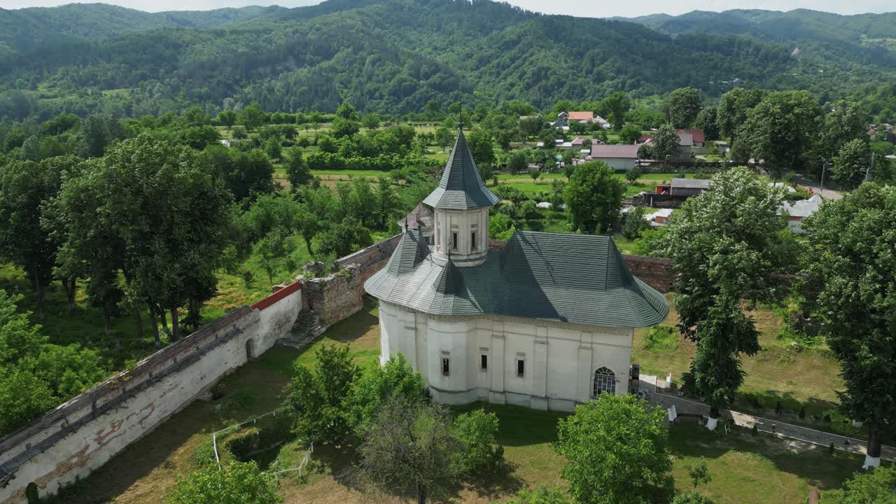 Manastirea Mera Orthodox Monastery In Mera, Vrancea County, Romania. Aerial Ascending Shot
