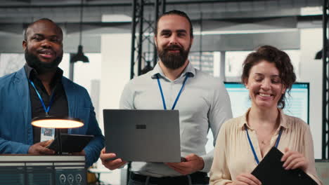 vertical video portrait of multiethnic employees work with performance metrics and high tech