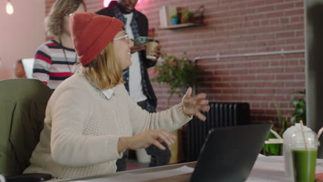 young-group-of-business-people-celebrating-successful-victory-watching-laptop-computer-enjoying-startup-project-success-cheerful-colleagues-teamowrk-celebration-in-happy-office