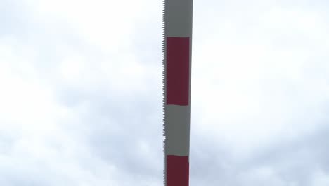 Details-Of-A-Wind-Turbine-Rotor-Blade-Against-The-Bright-Sky---pedestal-shot