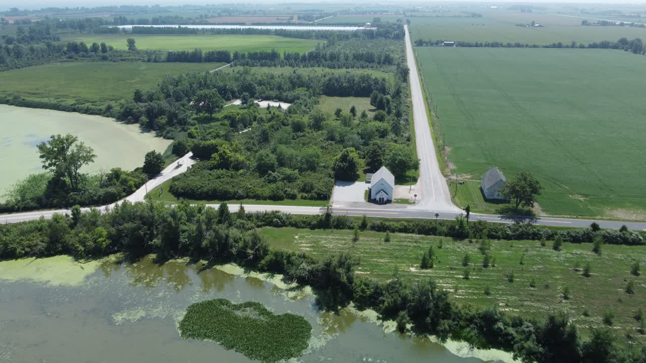Farm land in Canada with hazy sky in the background from forest fires