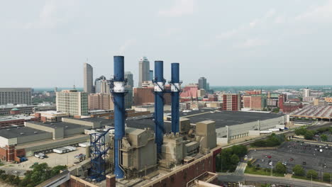 aerial view of power line at indianapolis downtown and city skyline at background in indiana, united states