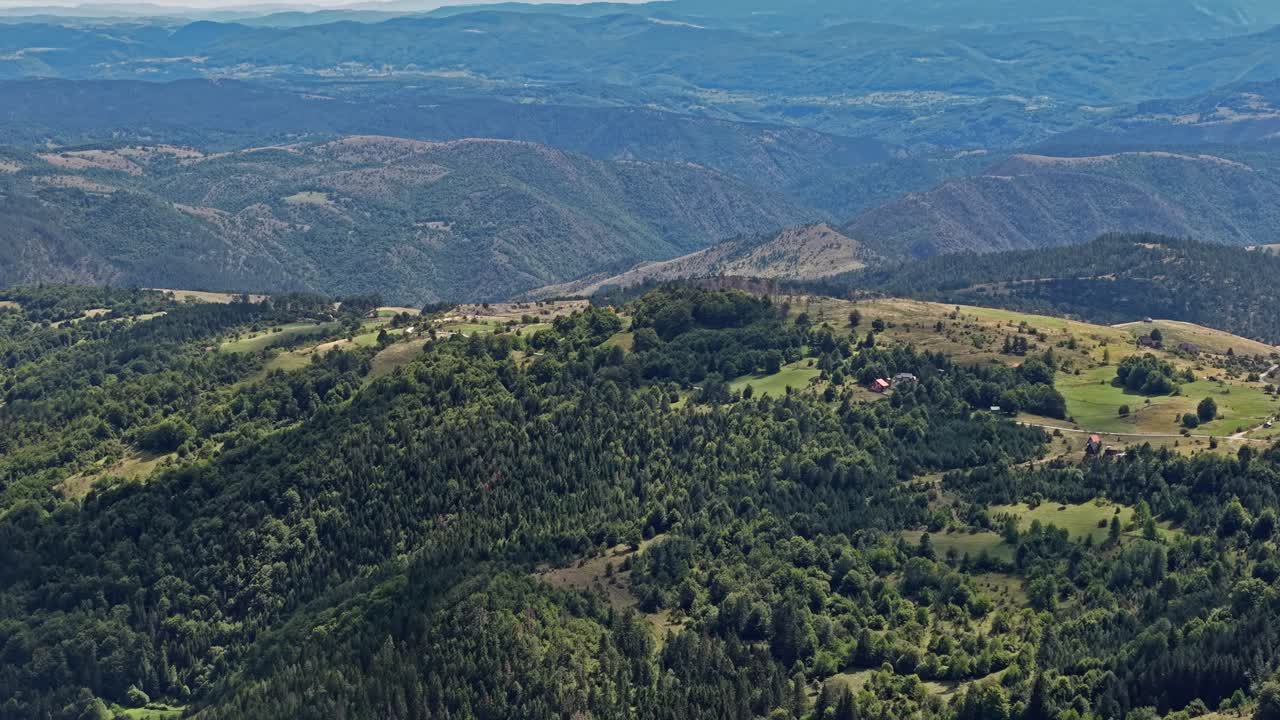 Aerial View of Picturesque Mountain Hills, Pine Forest and Village Homes on Sunny Day, Zlatibor, Serbia