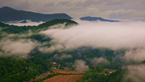 cinematic drone flyby over fog-bound appalachian scenery