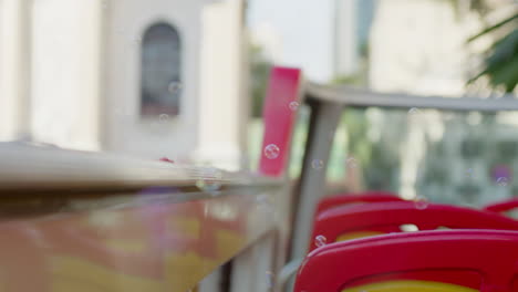 soap-bubble-close-up-with-vibrant-summer-colour-tour-bus-sit