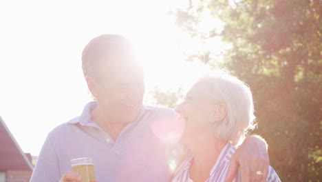 Portrait-Of-Senior-Couple-Enjoying-Outdoor-Summer-Drink-At-Pub