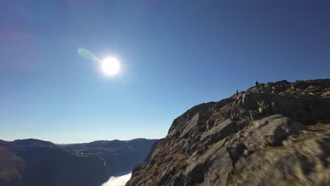 hiking to the mountain peak with stunning views of the fjord