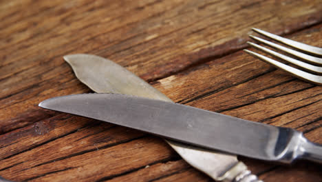 various cutlery on wooden table 4k