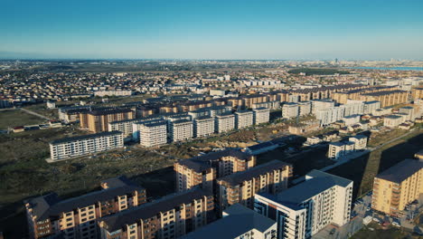 drone revealing shot over a building complex with many symmetrical buildings 4k