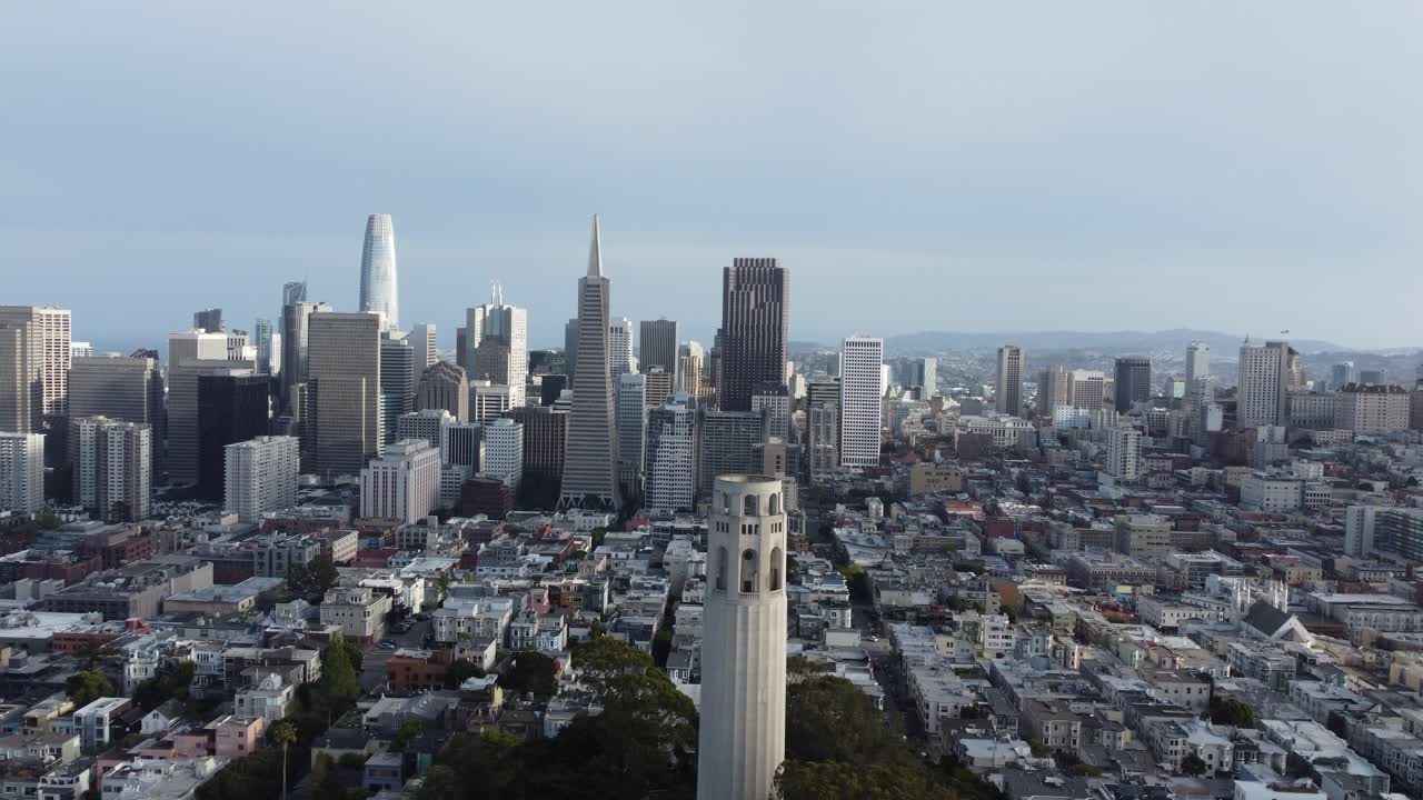 Coit Tower And The San Francisco Skyline. Aerial Reverse Ascend (Establishing Shot).