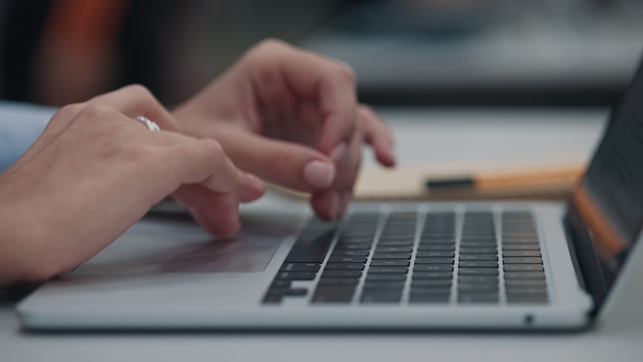 Woman typing on a laptop