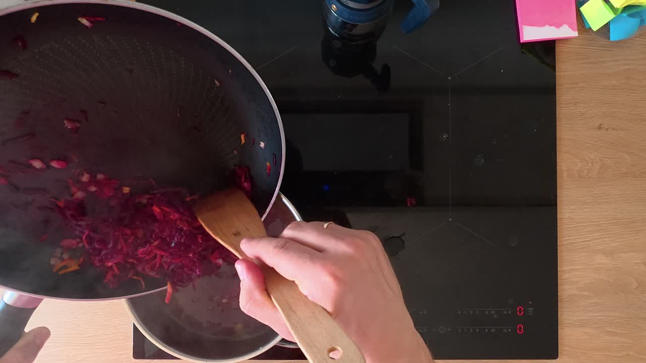 Watch a close-up shot of fresh beetroot being sautéed on a modern stovetop. The vibrant colors and rich textures create a tantalizing visual experience for culinary enthusiasts