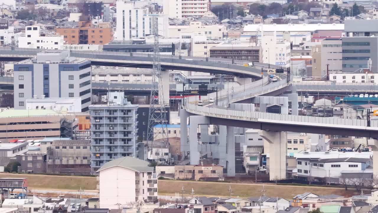 A dynamic scene showcasing elevated highways weaving through urban buildings and infrastructure.