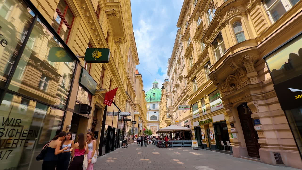 Vienna, Austria - June 9, 2025: Nice walk by the beautiful street in the old town of Vienna, Austria. Low angle view at the stunning architecture of the historical city
