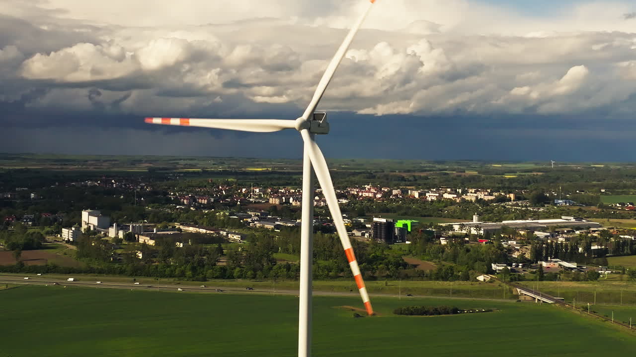 Windmill Rotating In Wind Farm - Drone Shot