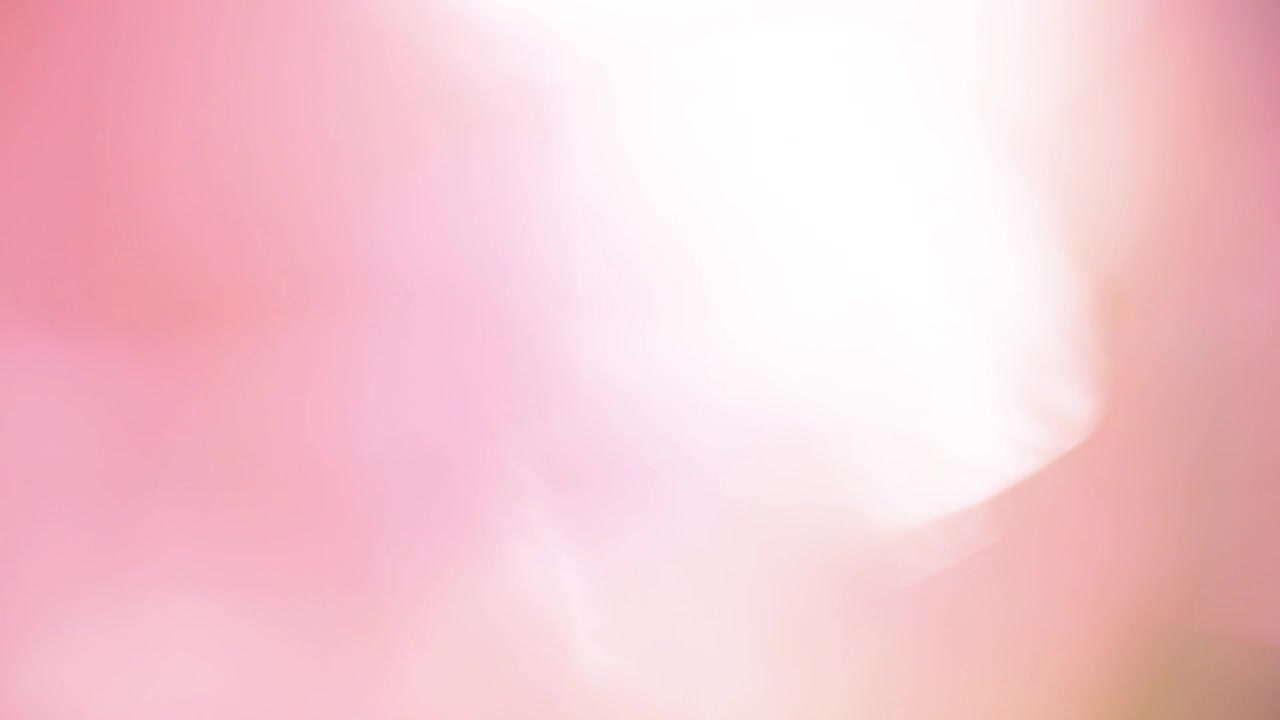 Transición bokeh de fuga de luz suave y cálida en tonos rosa y naranja