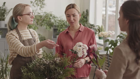 Women Florists Discussing Flower Arrangement