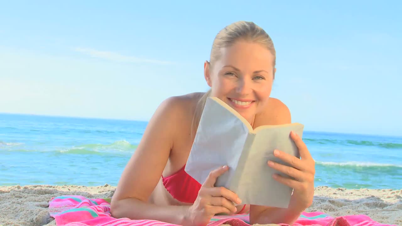 Attractive blond girl on a beach