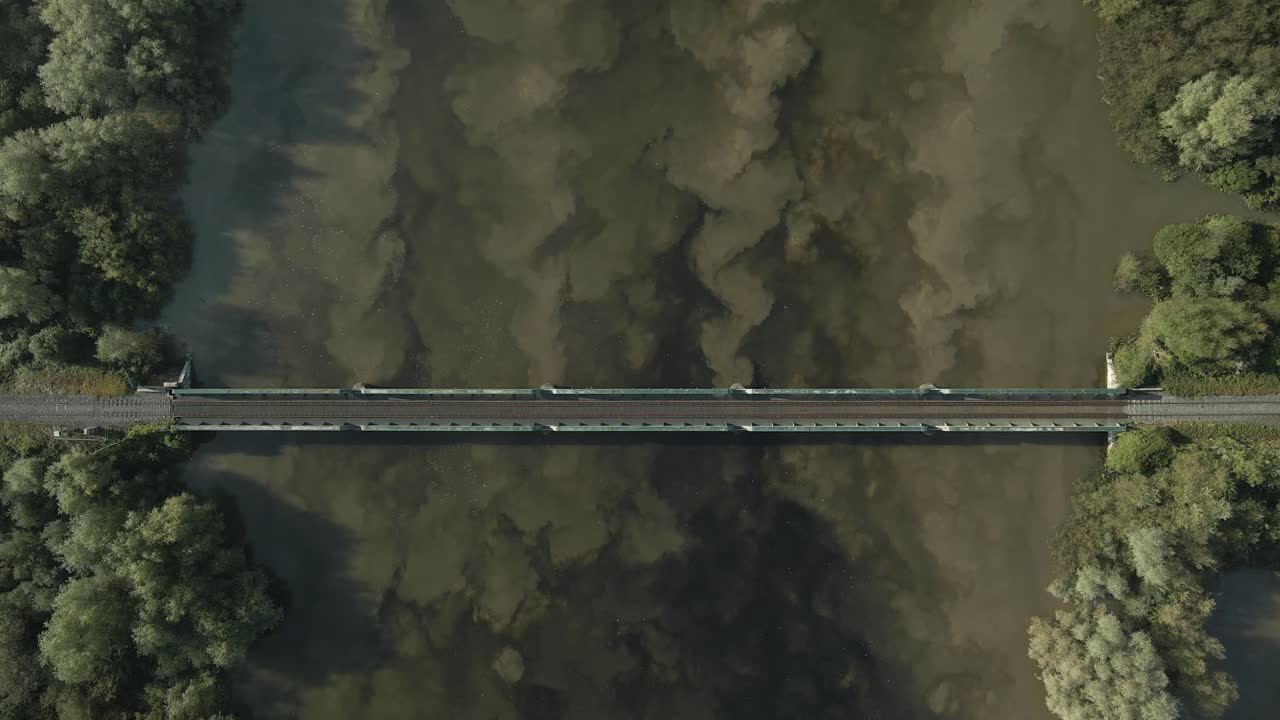 Above View Of Parteen Railway Bridge Over Shannon River In Limerick, Ireland. Aerial Descending Shot
