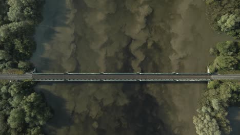 above view of parteen railway bridge over shannon river in limerick, ireland. aerial descending shot