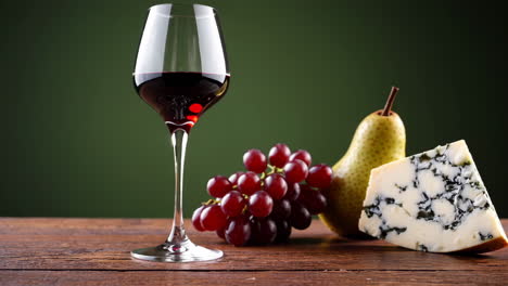 red wine, grapes, cheese, and pear