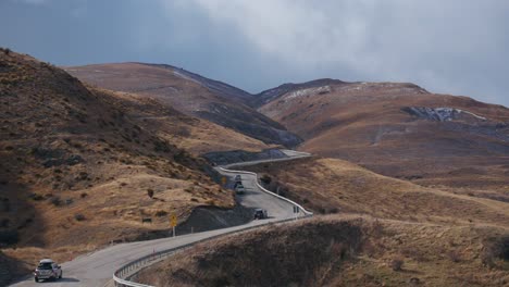 cars driving on curvy mountain road