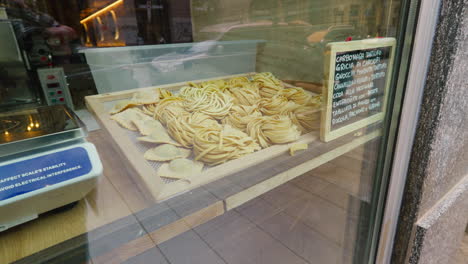 handcrafted pasta displayed in shop window in italy