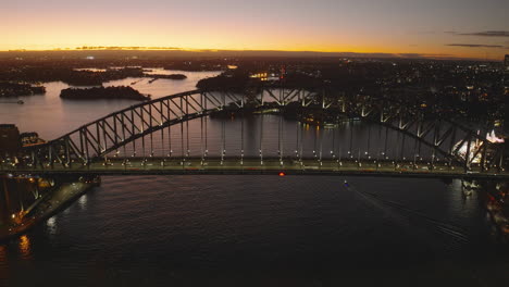 sydney harbor bridge, golden hour sunset afterglow, wide angle establishing cinematic aerial