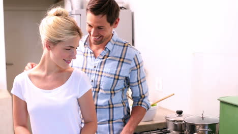 happy young couple cooking together