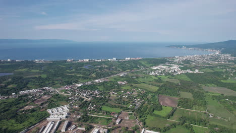 Drone-view-of-Banderas-Bay,-highlighting-the-hotel-coast-of-Nuevo-Vallarta-and-surroundings,-with-the-bay-in-the-distance