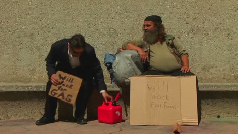 men hold up cardboard signs on the street