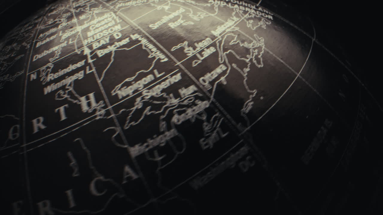 Close-up of a detailed spinning globe, focused on North America.