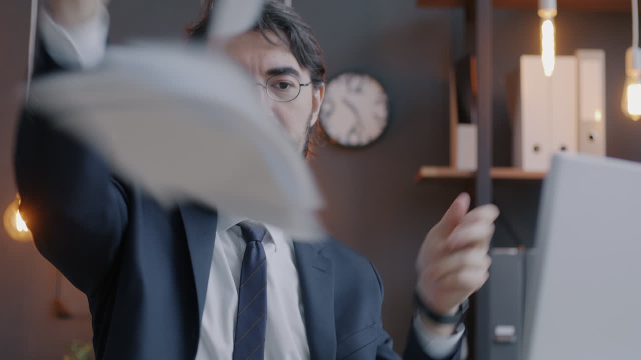 Frustrated Businessman Crumples Documents