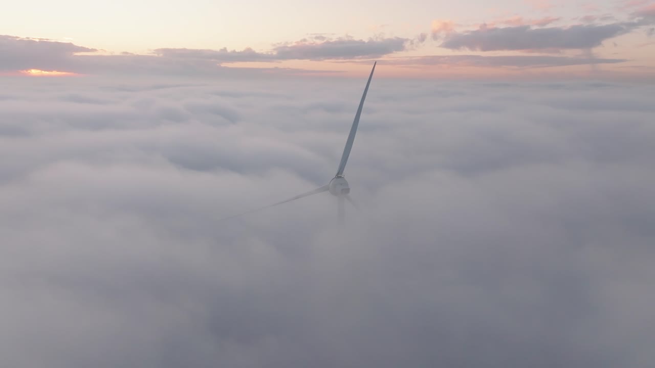 Drone shot of a Windturbine in cloudy conditions