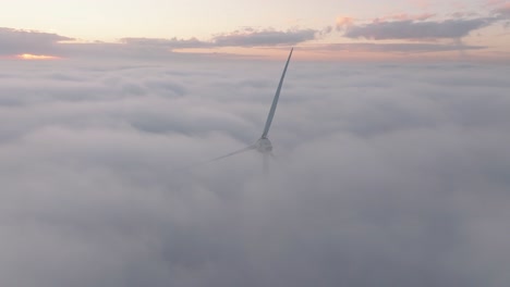 drone shot of a windturbine in cloudy conditions