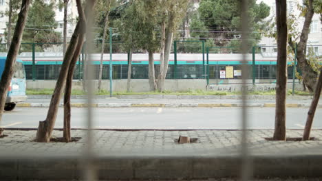 train is passing through suburban areas of a city for transportation, driving forward side by side with diesel fuel car in slowmo