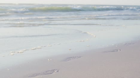 video of calm sea waves and sand beach