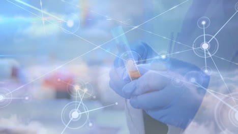 animation of network of connections over hands in protective gloves holding laboratory sample