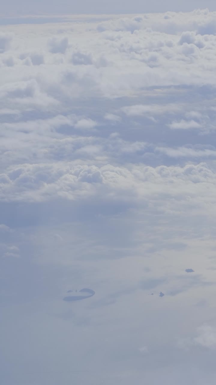 Aerial view of ocean and clouds, serene and calm atmosphere