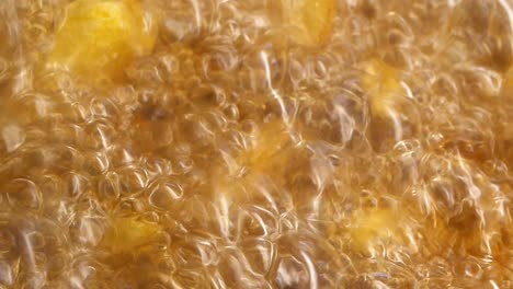 potatoes frying in hot oil
